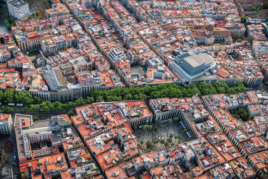 Aerial view of Barcelona Old Town streets and famous La Rambla boardwalk, Spain