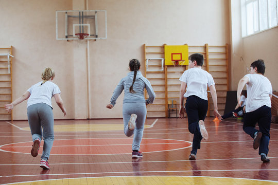 Primary School Children A Sport Lesson Indoors