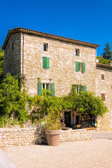 Fototapeta na wymiar Old residential house with a shop in the small French medieval village Labeaume near the Ardeche