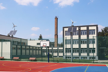 Lubno, Poland - july 9 2018:An open stadium in the courtyard of a village school. Eduction of the younger generation. Sports ground for football, volleyball and basketball. Lighting on natural sources