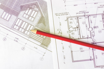 The architectural plan of the house is printed on a white sheet of paper. A red pencil on it. June 2018, Russia, Moscow