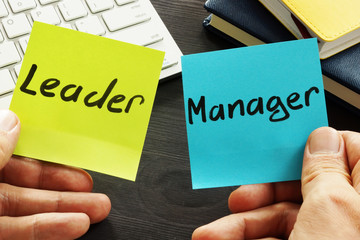 Leader vs manager. Man is holding memo sticks. - obrazy, fototapety, plakaty