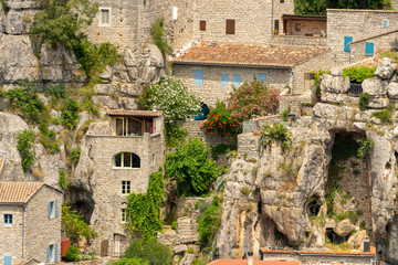 Old houses made of natural stone of the village Labeaume in France, built on the rock walls and gorges of the Ardeche