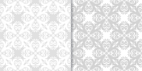 Light gray floral backgrounds. Set of seamless patterns