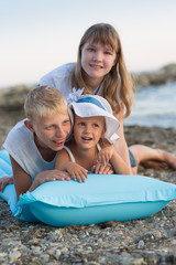 Three children on the beach