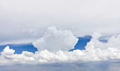 White big rain cloud with blue sky before the rain