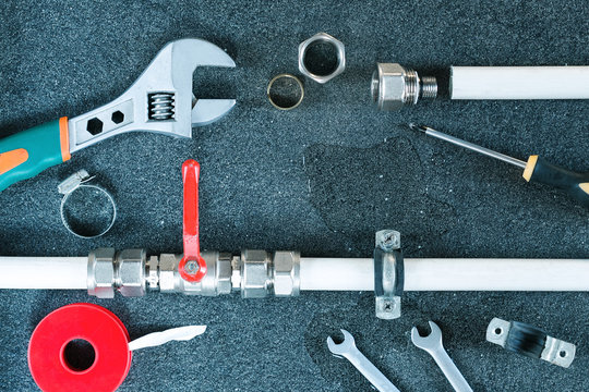Plumber tools and equipment in a bathroom, plumbing repair service,repair concept.Top view.Plumbing background.