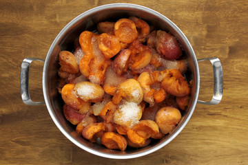 cleaned apricots with shugar ready for making jam