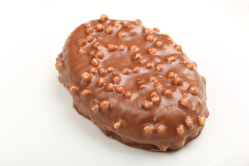 Single chocolate candy with Rice Krispies Cereal on a white