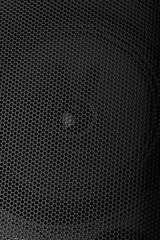 Black speaker grill texture close-up. Background