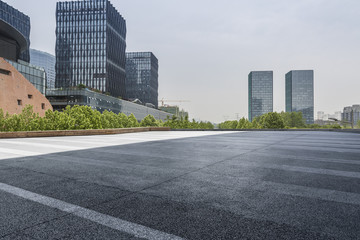 Panoramic skyline and modern business office buildings with empty road,empty concrete square floor