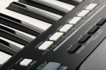 Piano keyboard and controls of synthesizer