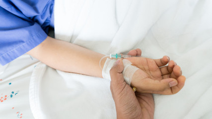 woman patients hand holder by his boy friend