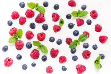Fototapeta na wymiar Food background, raspberries and blueberies on yogurt
