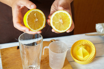 extruding juice from a lemon