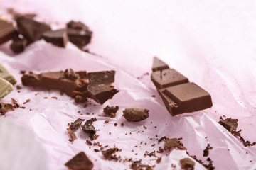 Delicious chocolate candies on parchment
