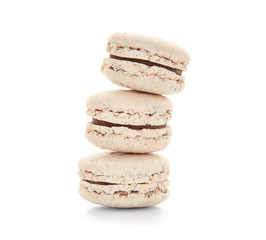 Tasty macarons on white background