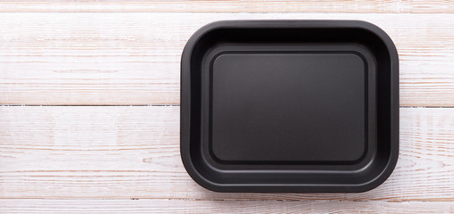 Empty baking tray for pizza close up on white wooden background top view square. Mock up for design