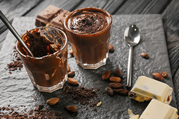 Glasses with molten chocolate on slate plate