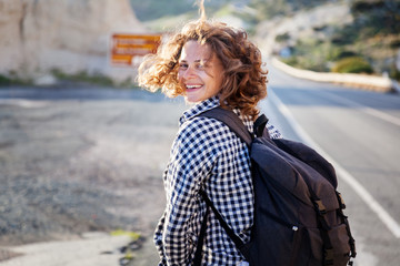 Naklejka premium Young beautiful happy smiling woman, summer portrait, fluttering hair, summer adventures and travel