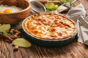Tasty homemade apple pie on wooden table