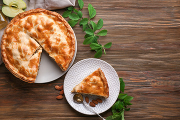Tasty homemade apple pie on wooden table