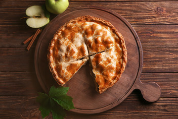 Tasty homemade apple pie on wooden table