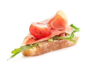 Tasty sandwich with prosciutto on white background
