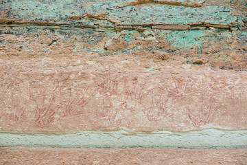 Rock art includes both humanoid and animal figures on cliffs above the Mekong estimated to be 3,000 years old at Pha Taem National Park in Ubon Ratchathani, Thailand