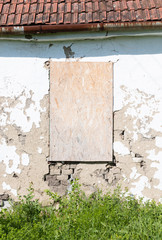 Broken window of an abandoned house