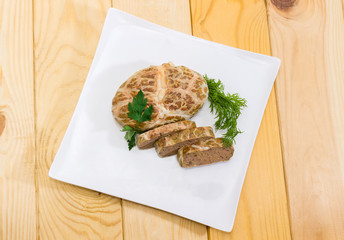 Top view of baked chopped pork liver pate on dish