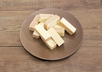Wafer biscuits on the brown dish