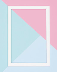 Abstract geometrical pastel blue, teal and pink paper flat lay background. Minimalism, geometry and...