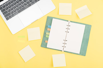 notebook on yellow background