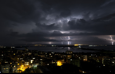 Fototapeta premium Spectacular Thunderstorm in dark night sky above city