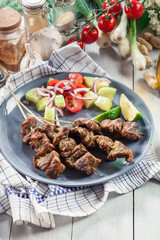Traditional pork satay with peanut sauce and vegetables