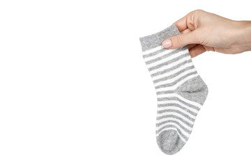 Cotton kid socks with hand, isolated on white background. copy space template