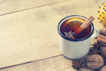 Traditional mulled wine in mug with spice