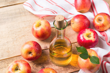 Apple cider vinegar in bottle with apple