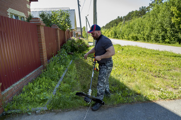 A man with a lawn mower