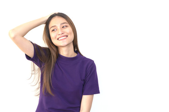 Portrait Of A Young Smiling Asian Woman Pushing Her Hair Back With White Background.