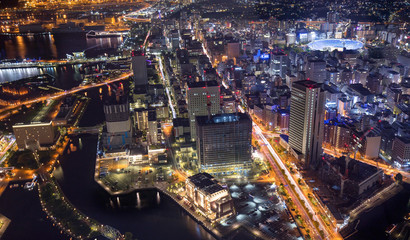 Fototapeta na wymiar aerial view of waterfront buildings and traffic lights of Yokohama at night