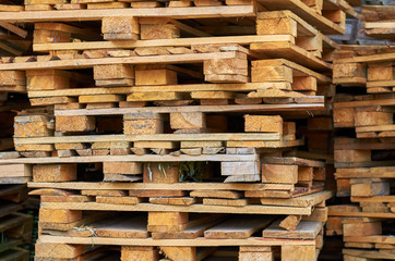 Wooden pallets stacked on top of each other.