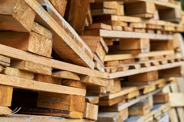 Wooden pallets stacked on top of each other.