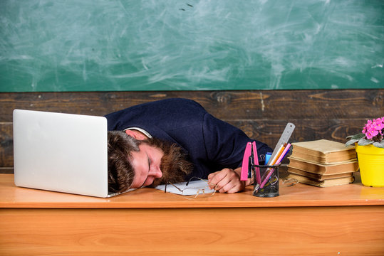 Life of teacher exhausting. Fall asleep at work. Educators more stressed work than average people. Educator bearded man sleep table classroom. High level fatigue. Exhausting work school cause fatigue