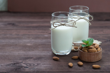 Almond milk,two glasses on the table with almond.
