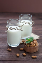 Almond milk,two glasses on the table with almond.