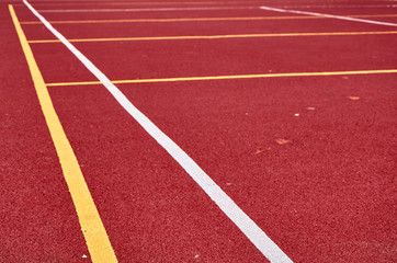Decorative rubberized Jogging coating at the street stadium in outdoor with white line. Sport Background