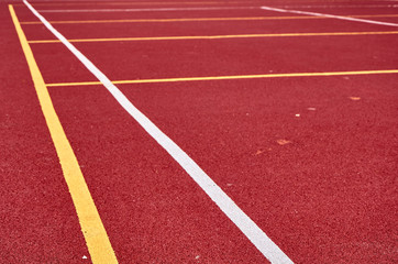 Fototapeta premium Decorative rubberized Jogging coating at the street stadium in outdoor with white line. Sport Background