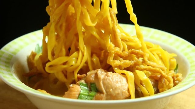 Curried noodle soup or Khao soi , Thai food